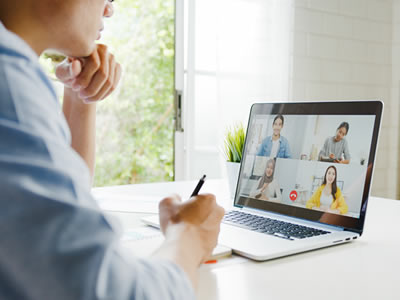 National Thrombosis Week 2023 - Person at virtual conference with multiple speakers